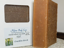 Load image into Gallery viewer, Bar of Cracklin Birch soap next to Alpine Body Care packaging on a neutral background