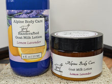 Load image into Gallery viewer, Two containers of Alpine Body Care Lemon Lavender goat milk lotion on a textured surface.